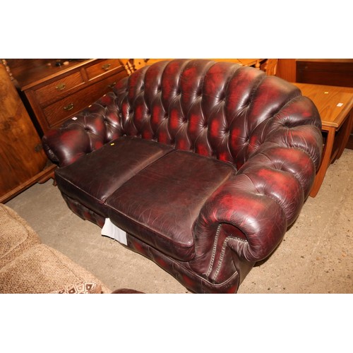 647 - 2 seater red leather chesterfield style sofa