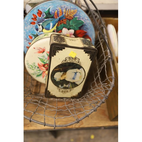 291 - Vintage tins in wire basket