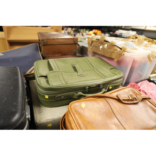 335 - 7 vintage suitcases & 1 laptop bag