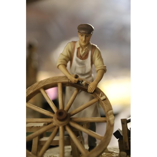 448 - Leonardo collection figure farmer repairing wheel