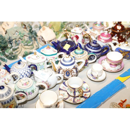 547 - Collection of miniature tea pots, cups & saucers