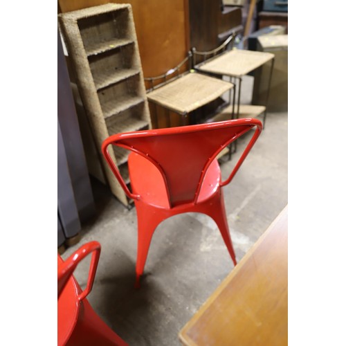 600 - Pair of red metal chairs