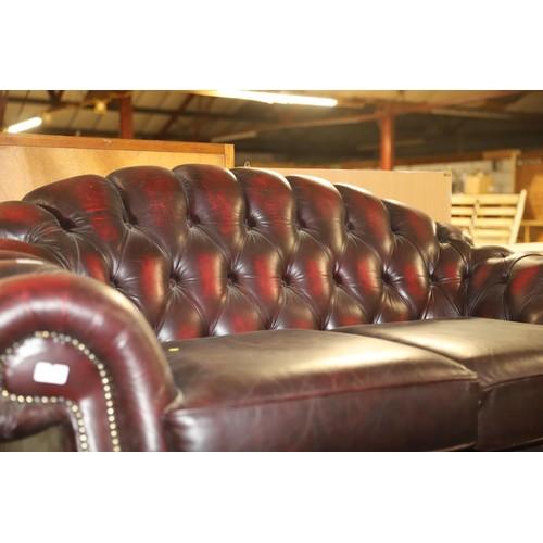 647 - 2 seater red leather chesterfield style sofa