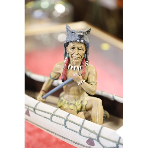 388A - American native and dog in canoe