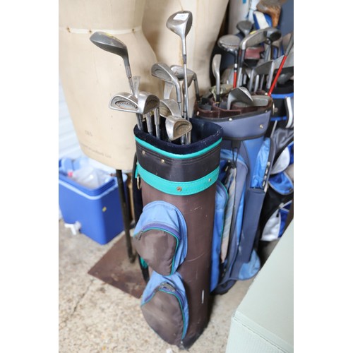 143 - 3 golf bags & various clubs