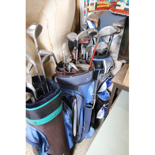 143 - 3 golf bags & various clubs