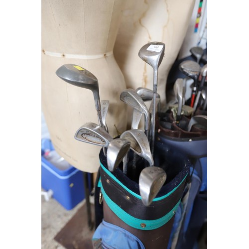 143 - 3 golf bags & various clubs