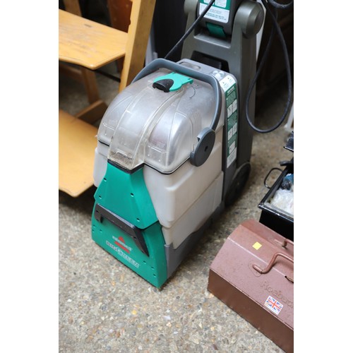 215 - Bissell carpet cleaner - warranted until 12 noon Tuesday following the above sale