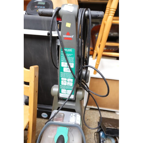 215 - Bissell carpet cleaner - warranted until 12 noon Tuesday following the above sale