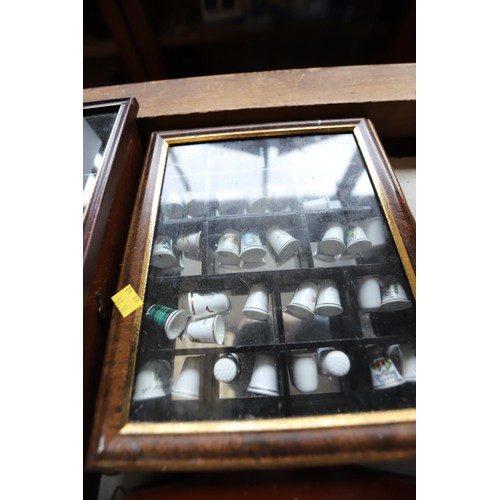 541 - Collection of thimbles & display case