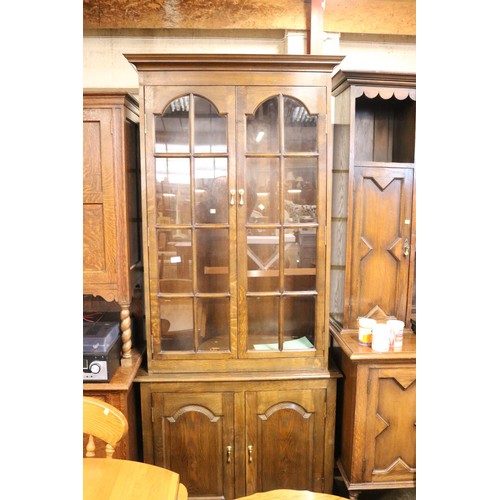 653 - Tall oak display case & cupboard