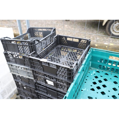 28 - Approx 20 small black stacking crates