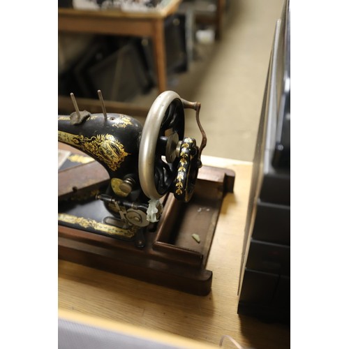 124 - Old Singer sewing machine in case