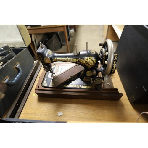 124 - Old Singer sewing machine in case