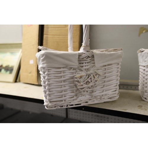 202 - 2 white wicker small handled baskets