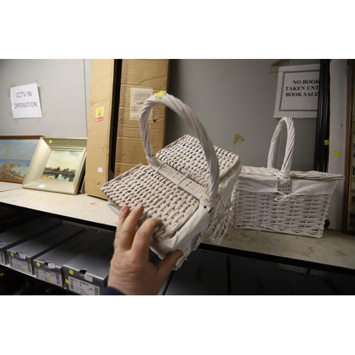 202 - 2 white wicker small handled baskets