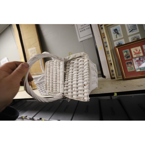 202 - 2 white wicker small handled baskets