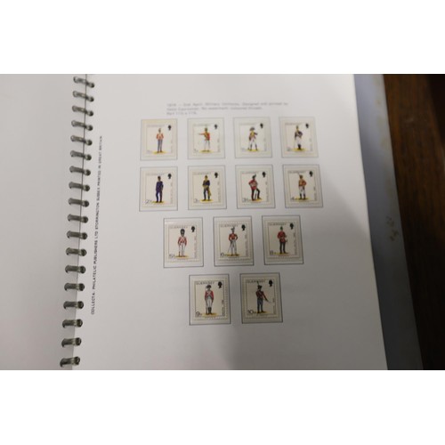 411 - 2 stamp albums, Channel Island & Isle of Man