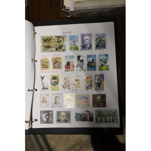 412 - Worldwide stamp collection, 1 album & 4 packs of album pages