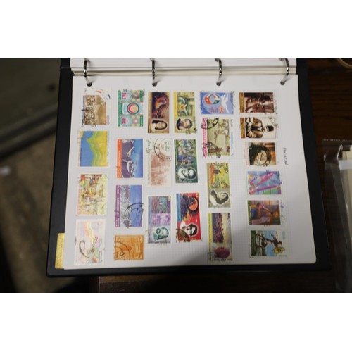 412 - Worldwide stamp collection, 1 album & 4 packs of album pages