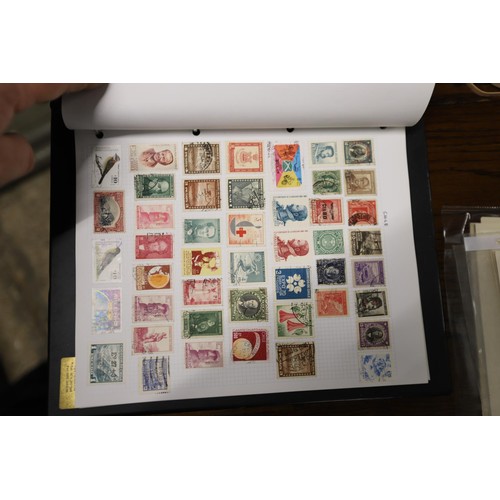 412 - Worldwide stamp collection, 1 album & 4 packs of album pages