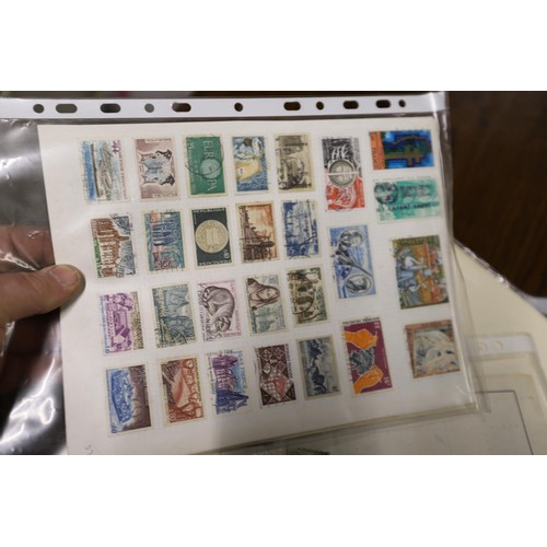 412 - Worldwide stamp collection, 1 album & 4 packs of album pages