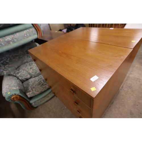 673 - teak 5 drawer chests on legs