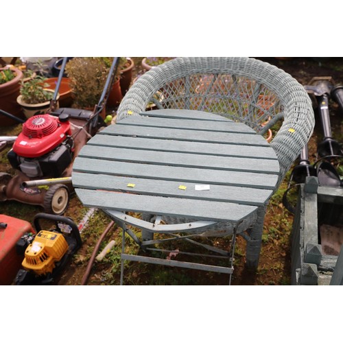 60 - Garden table with wicker armchair