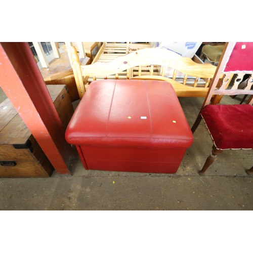 599 - fold out bed in red leather pouffe