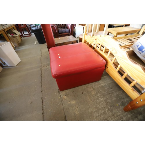 599 - fold out bed in red leather pouffe