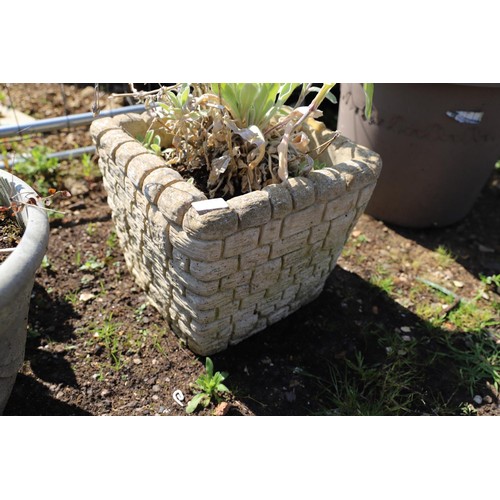 44 - Small brick planter with plant