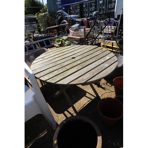 94 - Wooden garden table & 4 plastic garden chairs