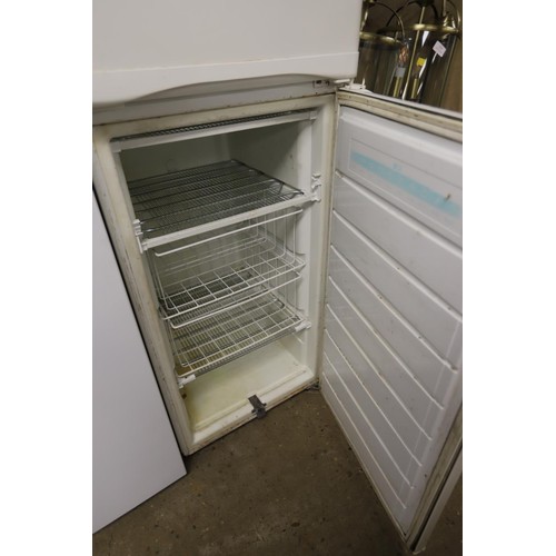 129 - Fridge freezer - warranted until 12 noon Tuesday following the above sale