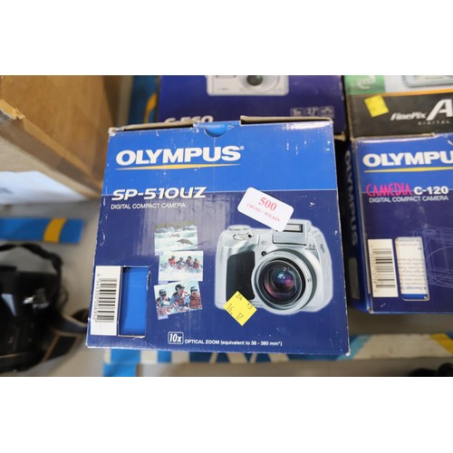 500 - 4 boxed digital cameras, Olympus, FujiFilm