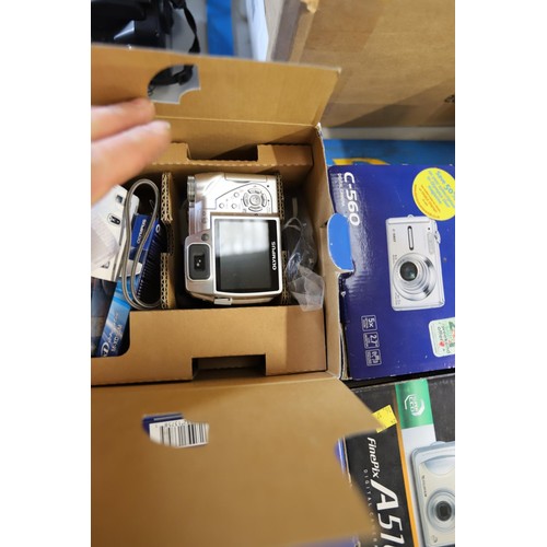 500 - 4 boxed digital cameras, Olympus, FujiFilm