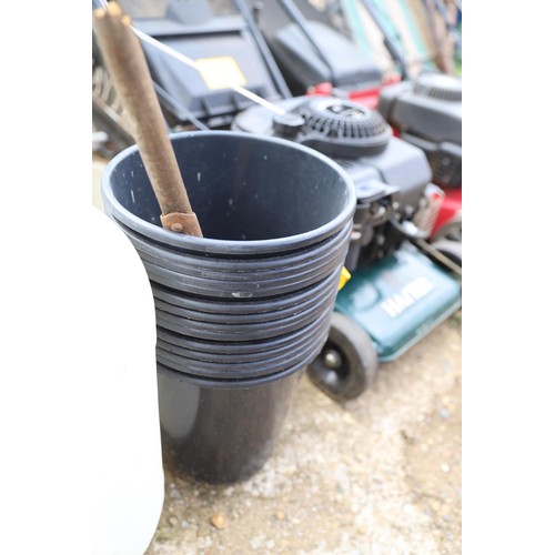 73 - Two plastic 20 L tanks quantity of garden pots etc