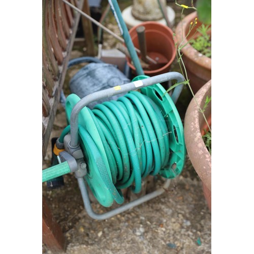 94 - Push mower, watering can, hosepipe etc