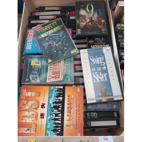 302 - 2 crates of VHS & DVDs