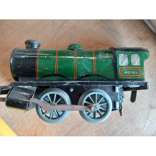 396 - Hornby clockwork train plus crossings