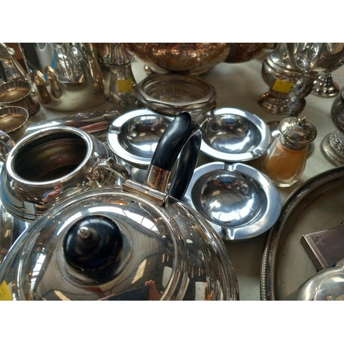 521 - Various silver plated items - tea sets, condiments, etc