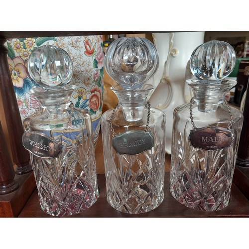 397 - Tantalus 3x crystal decanters lockable with 3 x silver hallmarked labels