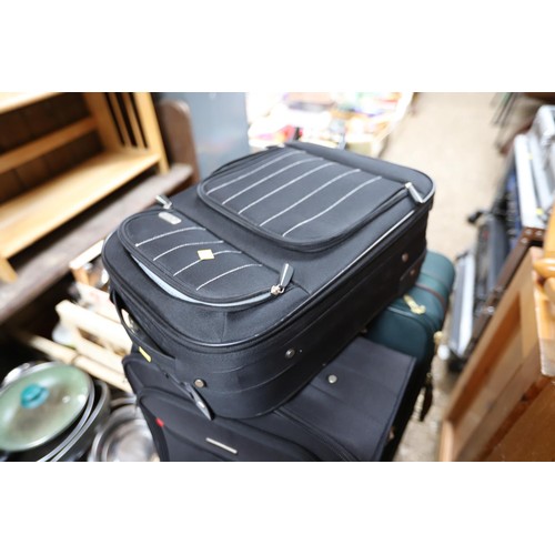 187 - Qty of various suitcases