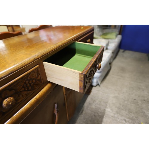 614 - Carved oak sideboard