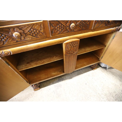 614 - Carved oak sideboard