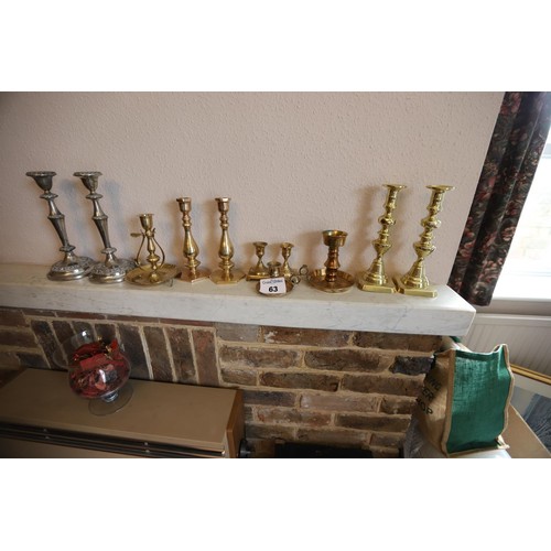 63 - 11 x brass & plated candlesticks