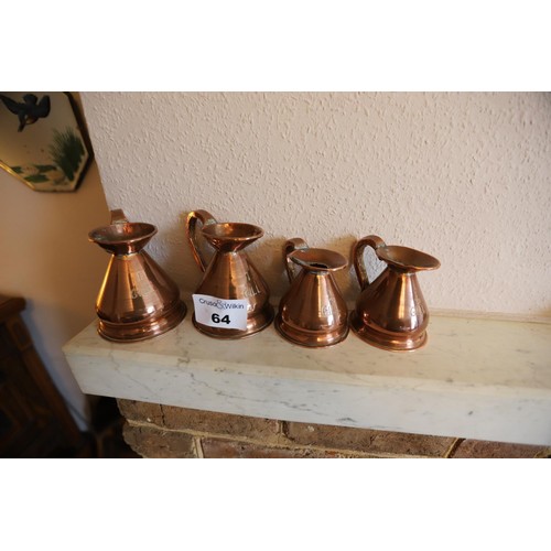 64 - 2 copper 1 gill jugs & 2 1/2 gill cpper jugs