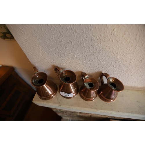 64 - 2 copper 1 gill jugs & 2 1/2 gill cpper jugs