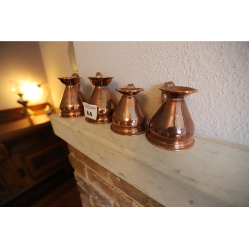 64 - 2 copper 1 gill jugs & 2 1/2 gill cpper jugs