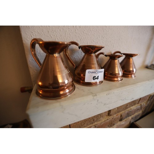 64 - 2 copper 1 gill jugs & 2 1/2 gill cpper jugs