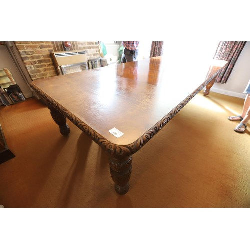 69 - Late Victorian \ early Edwardian heavily carved mahogany extending dining table with 3 extra leaves ... 